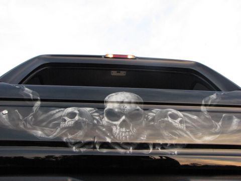 1979 Ford Bronco - This truck features an airbrushed design of skulls and smoke on its tailgate.