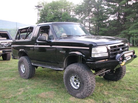 1979 Ford Bronco - This modified Ford Bronco features large off-road tires and a custom front bumper with an integrated light bar.
