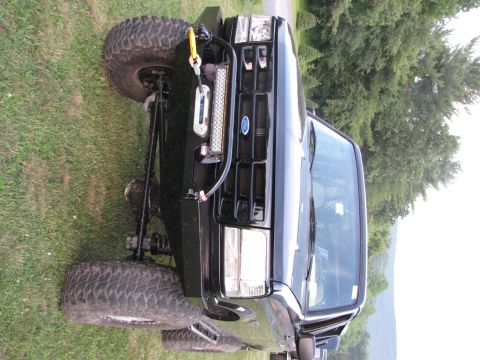 1979 Ford Bronco - This modified Ford Bronco features a winch and light bar, with its front end angled towards the viewer.