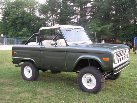 1979 Ford Bronco - This 1979 Ford Bronco is shown in a three-quarter front view, parked outdoors on a grassy area.