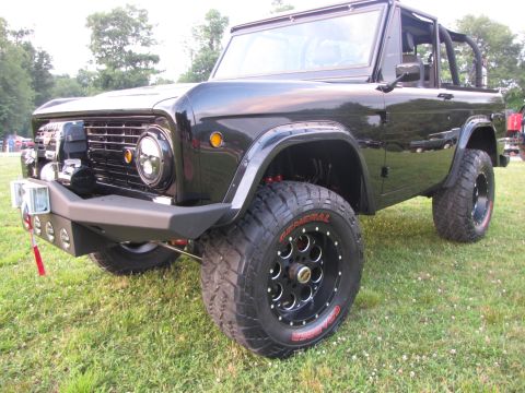 1979 Ford Bronco - This modified Ford Bronco features a custom front bumper and aggressive off-road tires.