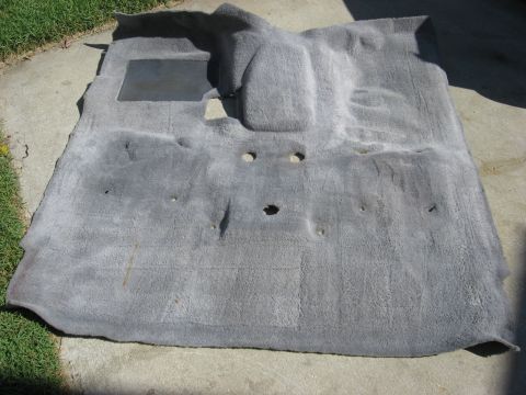 1994 Ford Bronco - Car carpet removed from vehicle for cleaning or replacement.