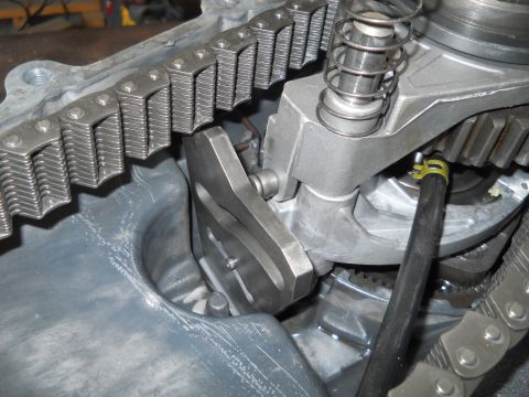 1992 Ford Bronco - Close-up view of internal transfer case components, including a chain and gears.