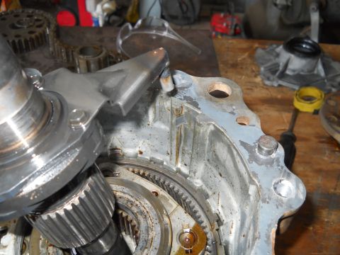 1992 Ford Bronco - A damaged transmission part is shown in detail, with gears and metal components visible.