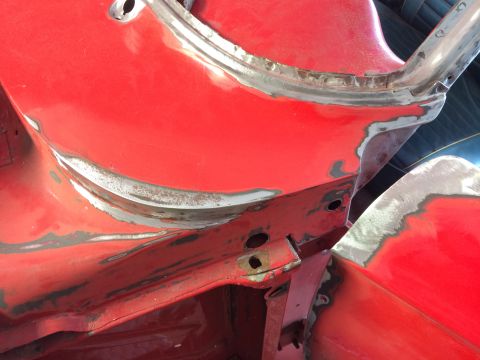 1964 Ford Fairlane - Car body panels undergoing repair work, showing grinding and primer application.
