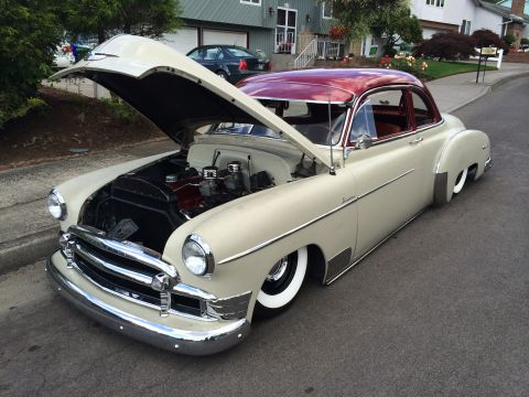 1964 Ford Fairlane - Customized 1950 Chevrolet sedan features a lowered stance and a V8 engine with dual carburetors.