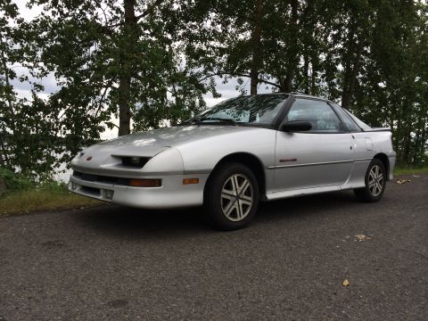 1990 Geo Storm GSi - This 1990 Geo Storm GSi coupe is seen from a three-quarter front angle, parked outdoors.