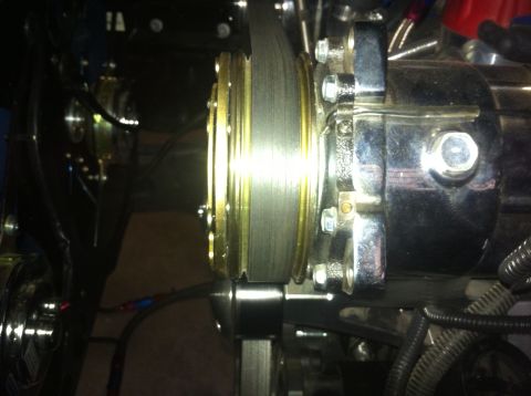 1982 Ford Bronco - Close-up of a chrome alternator and brake rotor assembly, likely from a custom build.