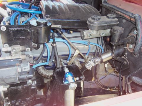 1968 Ford Bronco - Close-up of an engine bay, focusing on the brake master cylinder and power steering reservoir.