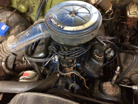 1973 Ford Torino - Close-up view of the engine bay, highlighting the air cleaner assembly and various engine parts.