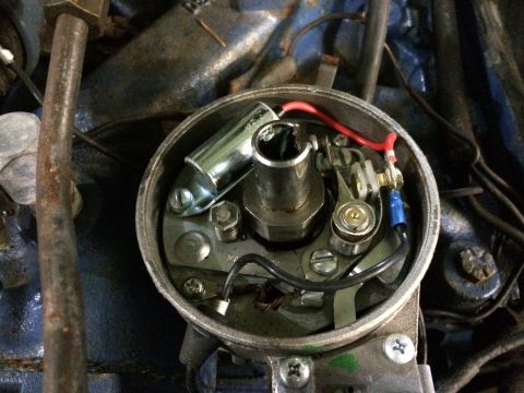1973 Ford Torino - Distributor cap interior showing points, condenser, and wiring connections.