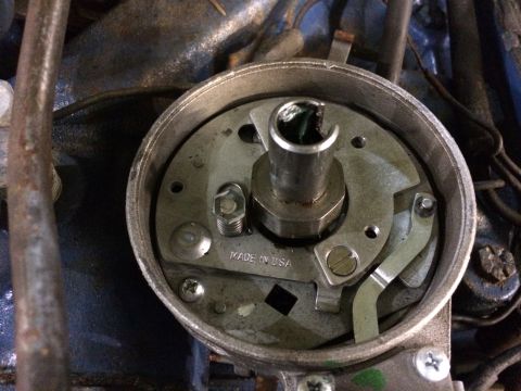 1973 Ford Torino - Close-up of a car's distributor cap interior, showing the rotor and "MADE IN USA" marking.