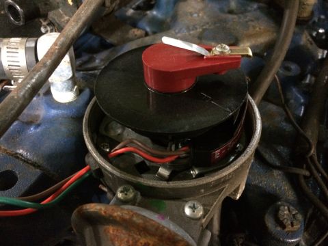 1973 Ford Torino - Automotive distributor cap and rotor assembly with visible wiring.