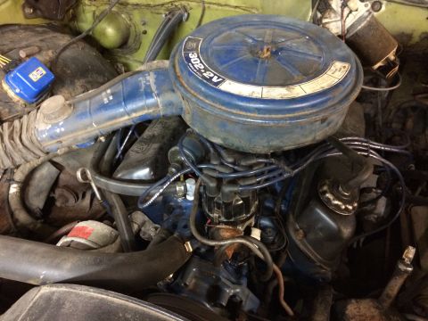 1973 Ford Torino - Close-up of a V8 engine, likely from a Ford vehicle, a prominent blue air filter housing.