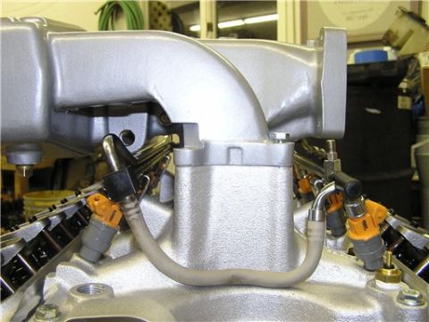 1993 Ford Bronco - This image shows fuel injectors and part of an engine's intake manifold, not a complete vehicle.