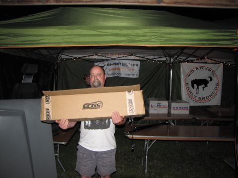 1979 Ford Bronco - A man holds a box from ECGS at an event with banners for Mid-Atlantic Early Broncos.