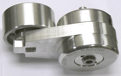 2003 Ford Crown Victoria - machined polished billet aluminum component, possibly a tensioner or pulley arm, engraved with Thumper Racing.
