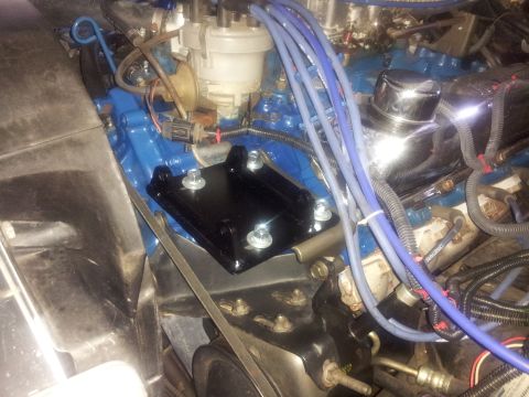 1976 Ford Ranchero - A new bracket is installed in the engine bay, with blue spark plug wires and other engine components visible.