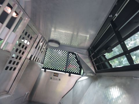 2001 Ford Crown Victoria - The interior of a K-9 transport vehicle, showing the specialized compartment for a police dog.