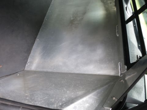 2001 Ford Crown Victoria - Metal flooring and interior trim visible in the cargo area of a vehicle.