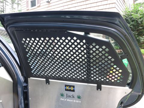 2001 Ford Crown Victoria - Interior partition with K-9 decal and memorial text for "Jack" dated 10-29-11.