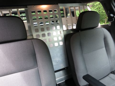2001 Ford Crown Victoria - Interior view of a vehicle's back seats and a metal partition.