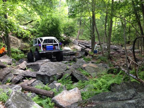 1988 Ford Bronco - Ford Bronco tackling a challenging rocky off-road course.