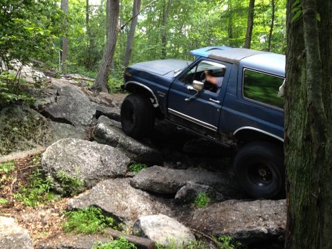 1988 Ford Bronco - This blue 1987 Ford Bronco tackles a challenging rock crawling course.