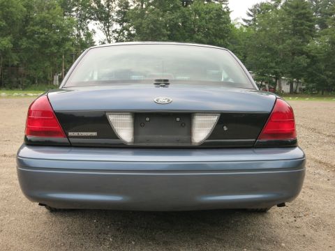 2001 Ford Crown Victoria - Rear view of a blue 2001 Ford Crown Victoria Police Interceptor parked outdoors.