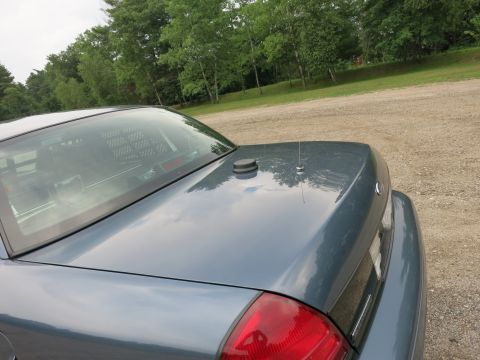 2001 Ford Crown Victoria - Rear view of a blue 2001 Ford Crown Victoria parked outdoors.