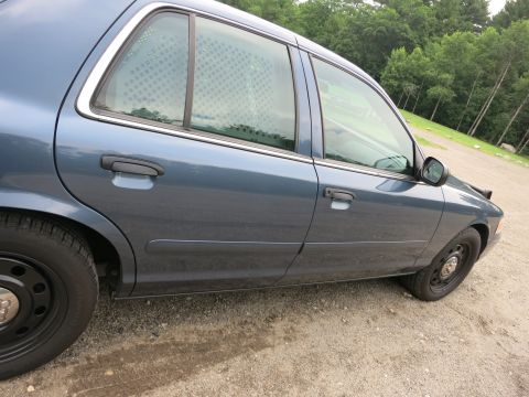 2001 Ford Crown Victoria - This 2001 Ford Crown Victoria police car features cage windows in the rear doors.