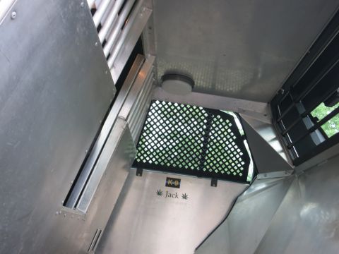 2001 Ford Crown Victoria - Interior view of a K-9 transport vehicle with visible text 'K-9 Jack' and a grated window.