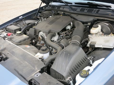 2001 Ford Crown Victoria - Engine compartment of a 2001 Ford Crown Victoria, detailing the V8 engine and associated components.