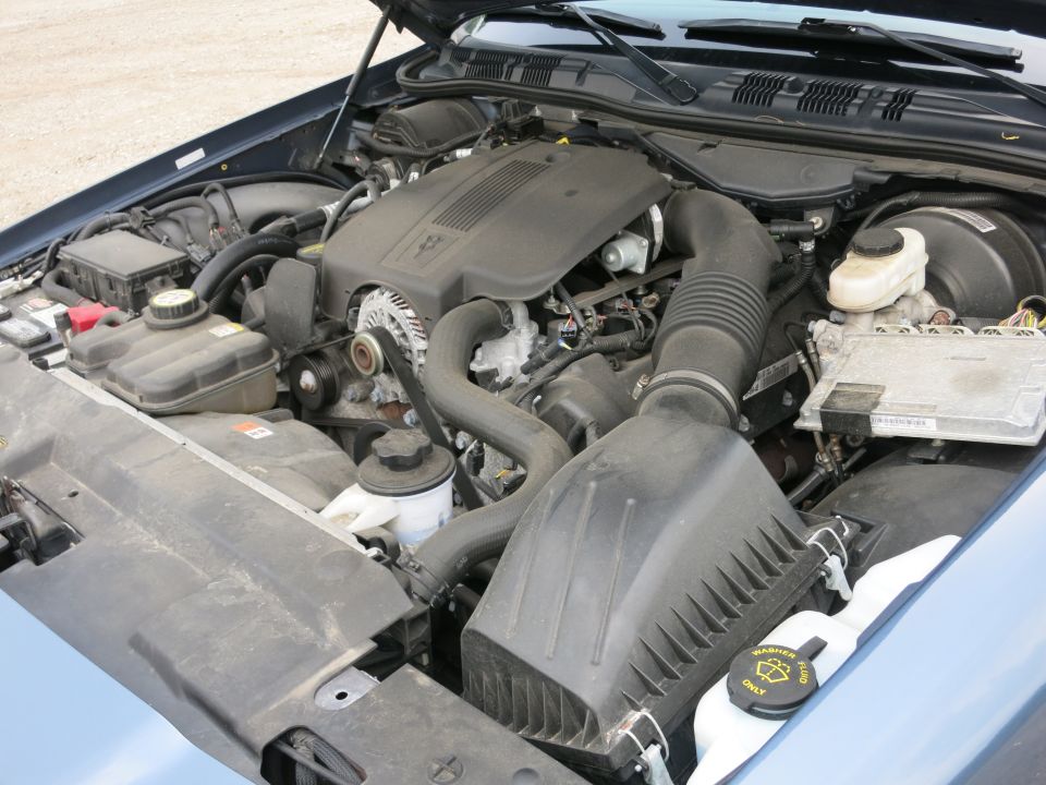 2001 Ford Crown Victoria engine bay showing the V8 engine, air intake, and coolant reservoir