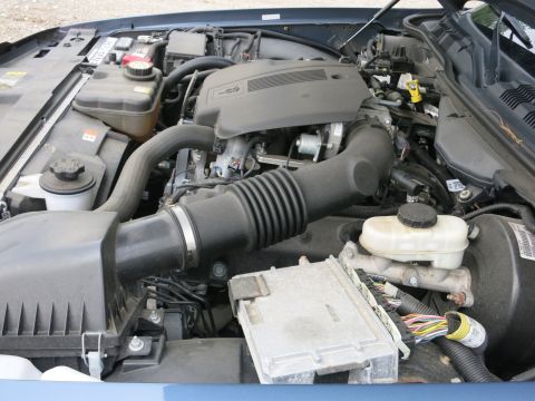 2001 Ford Crown Victoria - Close-up view of a car's engine compartment, showing various components and wiring.