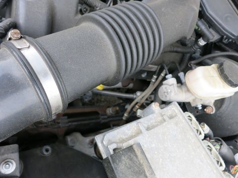 2001 Ford Crown Victoria - Engine bay details showing the air intake system and brake fluid reservoir.
