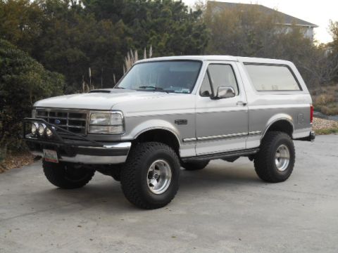 1994 Ford Bronco - This lifted 1994 Ford Bronco features a two-tone paint scheme and aggressive off-road tires.
