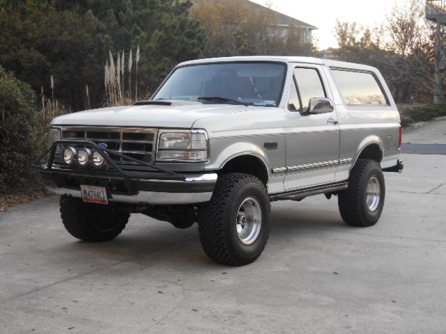 1994 Ford Bronco with aftermarket brush guard and off-road tires