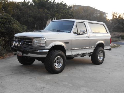 1994 Ford Bronco - This 1994 Ford Bronco features a two-tone paint scheme and an aftermarket front bumper with auxiliary lights.