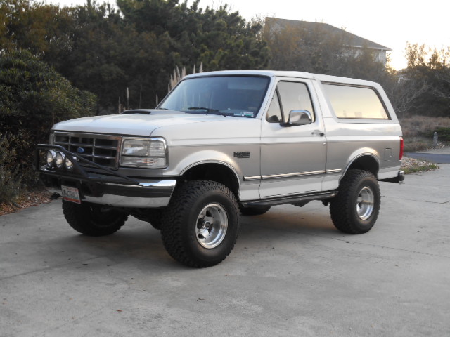1994 Ford Bronco, front 3/4 view, white and silver two-tone