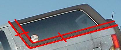 1989 Ford Bronco - Annotated close-up of the rear side window and roofline of a silver-gray SUV, with red drawn lines overlaid to mark a proposed trim or mold…