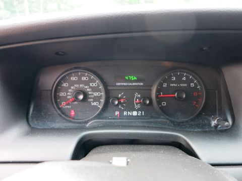 2001 Ford Crown Victoria - The instrument cluster displays vehicle speed, engine RPM, fuel level, and temperature, along with a digital calibration message.