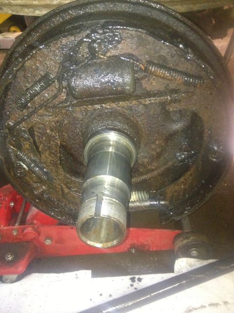 1970 Ford F-250 - Close-up of a greasy drum brake assembly, likely from a truck or heavy vehicle.