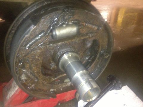 1970 Ford F-250 - This is a close-up view of a vehicle's brake drum assembly, showing internal components like the brake shoes and wheel cylinder.