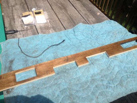 1970 Ford F-250 - Wooden dashboard trim is laid out on a blue mat with tools and hardware nearby.