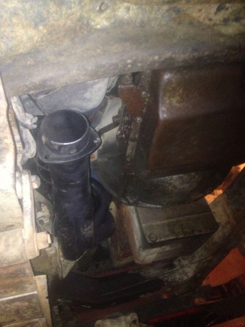 1970 Ford F-250 - Underside view of an exhaust pipe and transmission assembly.