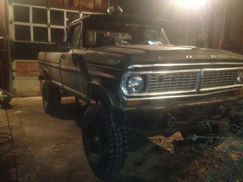 1970 Ford F-250 - This 1970 Ford F-250 truck is parked indoors, showing its distinctive front grille.