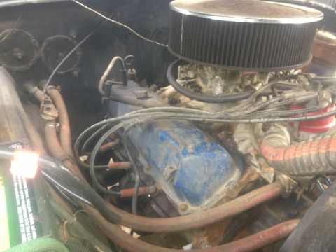 1970 Ford F-250 - Close-up view of the engine bay of a 1970 Ford F-250, showing various engine components.