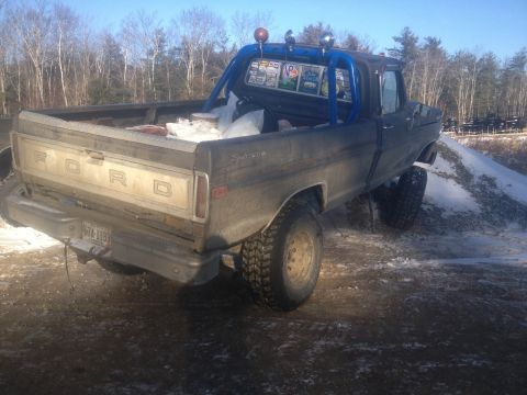 1970 Ford F-250 - This Ford F-250 pickup truck, likely from the mid-1970s, is parked on a dirt and snow-covered area.
