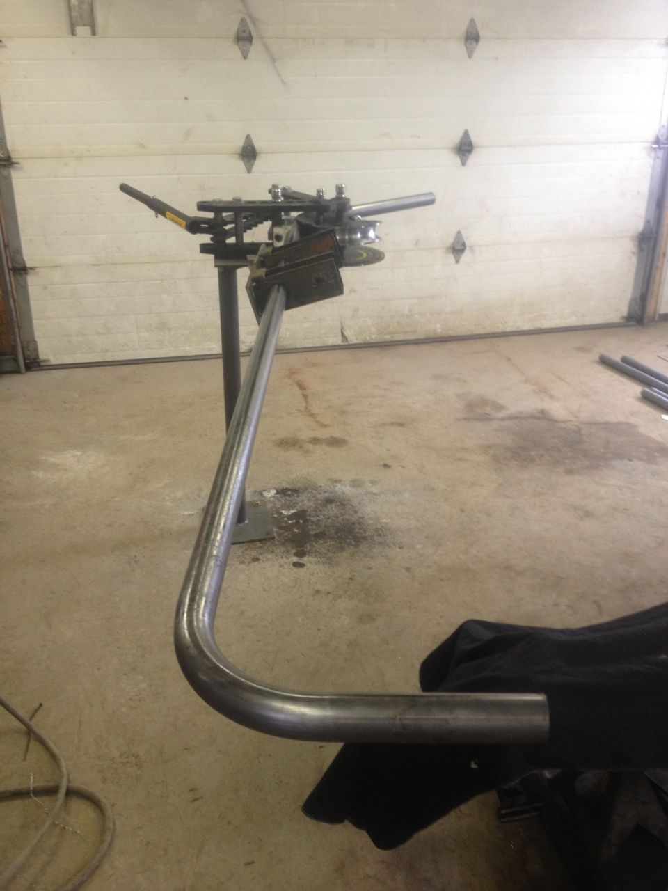 Tube bender with bent pipe
